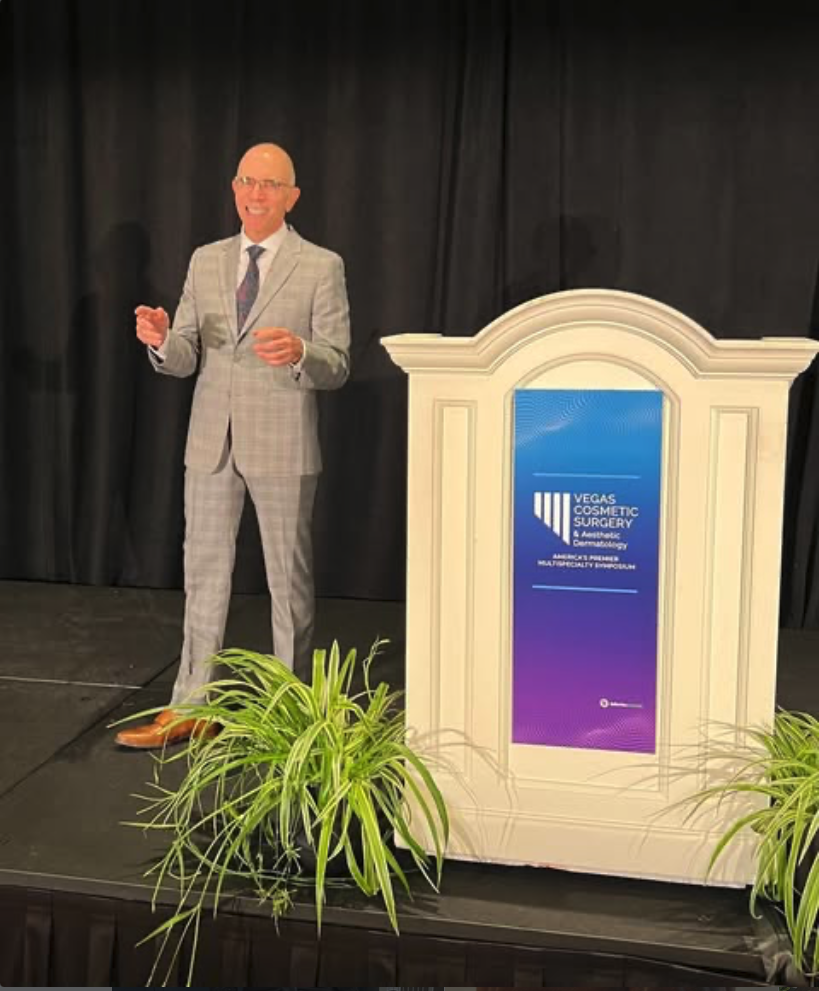Dr. Mark Tager presenting at a healthcare event